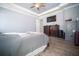 Large main bedroom featuring wood floors, tray ceilings, and ample storage space at 5118 Norriswood Dr, Mulberry, FL 33860