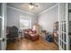 Cozy office space with hardwood floors, a leather chair, and a large window at 5118 Norriswood Dr, Mulberry, FL 33860