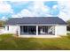 Back view showcasing the expansive screened patio, perfect for outdoor living at 5118 Norriswood Dr, Mulberry, FL 33860