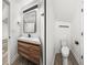 Modern bathroom featuring a floating wood vanity, sleek mirror, and stylish black fixtures at 720 W 14Th St, Lakeland, FL 33805