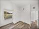 Bedroom featuring wood-look flooring, natural light, and a double door closet at 720 W 14Th St, Lakeland, FL 33805