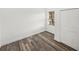 Bedroom featuring wood-look flooring, natural light, and a double door closet at 720 W 14Th St, Lakeland, FL 33805