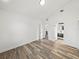 Bright bedroom featuring wood-look flooring, neutral walls, and an ensuite bathroom for modern living at 720 W 14Th St, Lakeland, FL 33805