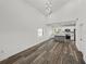 Bright, open-concept kitchen featuring modern appliances, a center island, and stylish wood-look flooring at 720 W 14Th St, Lakeland, FL 33805