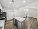 Bright, open-concept kitchen with stainless steel appliances and an island featuring a beverage refrigerator at 720 W 14Th St, Lakeland, FL 33805