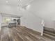 Open-concept living space with vaulted ceilings, modern lighting, stairs and contemporary kitchen at 720 W 14Th St, Lakeland, FL 33805