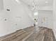 Bright, open-concept living space features soaring ceilings, modern lighting, wood floors, and a contemporary design at 720 W 14Th St, Lakeland, FL 33805