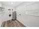 Bright utility room with a window, water heater and storage racks at 720 W 14Th St, Lakeland, FL 33805