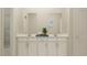 Bathroom featuring double vanity, white cabinets, and modern fixtures at 759 Terrapin Dr, Debary, FL 32713