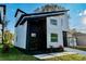 Charming two-story modern home featuring a dark accent wall and walkway at 720 W 14Th St, Lakeland, FL 33805