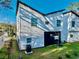 A bright, modern exterior features windows and a dark garage door at 720 W 14Th St, Lakeland, FL 33805