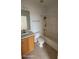 Well-lit bathroom features a vanity with sink, toilet, and a shower-tub combination at 1533 Still Dr, Clermont, FL 34714