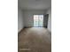 Spacious bedroom features neutral carpeting and sliding glass door at 1533 Still Dr, Clermont, FL 34714