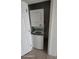 The laundry room has a stacked washer and dryer set for space-saving convenience at 1533 Still Dr, Clermont, FL 34714