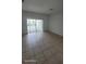 Bright living area features sliding glass doors leading to outdoor space at 1533 Still Dr, Clermont, FL 34714