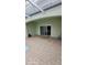 Paved patio leads to the interior through sliding glass doors, connecting indoor-outdoor living at 1533 Still Dr, Clermont, FL 34714