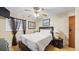 Comfortable bedroom with a ceiling fan, a large bed, and matching nightstands at 2453 Teri St, Auburndale, FL 33823