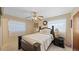 Cozy bedroom featuring a comfortable bed, ceiling fan, and ample natural light at 2453 Teri St, Auburndale, FL 33823