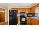 Well-equipped kitchen with ample counter space, wooden cabinetry, and modern appliances at 2453 Teri St, Auburndale, FL 33823