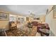 Spacious living room with a view of the dining area and large windows at 2453 Teri St, Auburndale, FL 33823