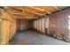 Interior view of a run-down shed with exposed wood and basic shelving at 2453 Teri St, Auburndale, FL 33823