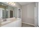 Bathroom features a double vanity, quartz countertops, and a walk-in shower with white subway tile at 5333 Sw 81St Cir, Ocala, FL 34481