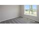Inviting bedroom with a large window offering natural light and views of the surrounding neighborhood at 5333 Sw 81St Cir, Ocala, FL 34481