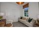 Cozy bedroom featuring a couch, large window, and neutral color scheme at 5333 Sw 81St Cir, Ocala, FL 34481