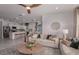 Open-concept living space showcasing a spacious living room and kitchen area with lots of natural light at 5333 Sw 81St Cir, Ocala, FL 34481