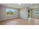 Bright living area with sliding door access and a large window with backyard views at 5333 Sw 81St Cir, Ocala, FL 34481