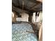 Interior view of dilapidated shed, featuring a weathered mattress, broken walls and debris at 0 Se 141St Pl, Umatilla, FL 32784