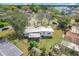 Aerial view of the home with a large backyard, patio and surrounding neighborhood at 1625 Crystal E Ct, Lakeland, FL 33801