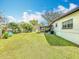 Nice backyard area featuring ample green space and a screened-in patio at 1625 Crystal E Ct, Lakeland, FL 33801