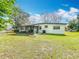Spacious backyard with a screened-in patio and lots of green space at 1625 Crystal E Ct, Lakeland, FL 33801