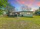 Spacious backyard featuring a screened-in porch and well-maintained lawn at 1625 Crystal E Ct, Lakeland, FL 33801