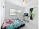 Bright bedroom with a TV, ceiling fan, and lots of natural light at 1625 Crystal E Ct, Lakeland, FL 33801