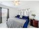 Bedroom featuring modern decor, a ceiling fan, and a dark wood nightstand at 1625 Crystal E Ct, Lakeland, FL 33801