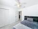 Comfortable bedroom with a bed, closet, and a ceiling fan for added comfort at 1625 Crystal E Ct, Lakeland, FL 33801