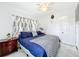 Bedroom boasts a ceiling fan, a double-door closet, and tasteful decorations at 1625 Crystal E Ct, Lakeland, FL 33801