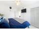Bright bedroom with a ceiling fan, a mounted TV, and a built-in closet at 1625 Crystal E Ct, Lakeland, FL 33801