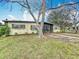 Charming single-story home with a well-maintained lawn and mature landscaping at 1625 Crystal E Ct, Lakeland, FL 33801