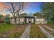 Charming single-story home with a well-maintained lawn and mature landscaping at 1625 Crystal E Ct, Lakeland, FL 33801