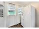 Kitchen showcasing a white refrigerator and a window providing natural light at 1625 Crystal E Ct, Lakeland, FL 33801