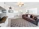 Bright living room featuring modern flooring, ceiling fan and large windows at 1625 Crystal E Ct, Lakeland, FL 33801