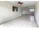 Bright and open living room with ceramic tile flooring and natural light at 1625 Crystal E Ct, Lakeland, FL 33801