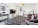 Bright living room featuring modern flooring, ceiling fan and large windows at 1625 Crystal E Ct, Lakeland, FL 33801
