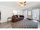 Charming living room with a comfortable couch, patterned rug, and a bright, airy atmosphere at 1625 Crystal E Ct, Lakeland, FL 33801