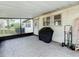 The screened-in patio boasts tiled floor and view of the backyard at 1625 Crystal E Ct, Lakeland, FL 33801