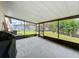 Screened-in patio featuring tiled floor and view of the backyard at 1625 Crystal E Ct, Lakeland, FL 33801