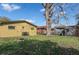 Spacious backyard with a mature tree providing shade at 1016 W 12Th St, Lakeland, FL 33805